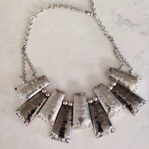A unique contemporary necklace created in gunmetal and silver.